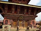 Kathmandu Changu Narayan 06 South Entrance To Changu Narayan Temple The roof struts of the Changu Narayan Temple south side feature multi-armed Tantric deities while below a pair of elephants guard the entrance. The temple main entrance is on the left.